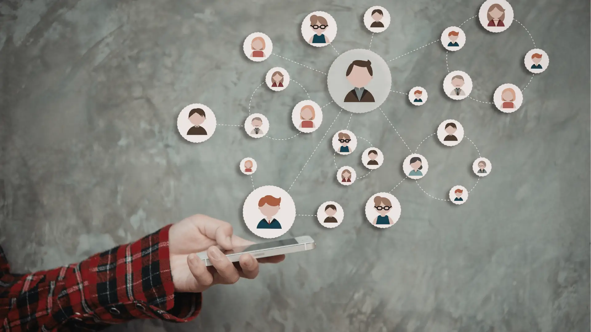 A hand holding a phone with illustrated social avatar nodes floating above it, representing connected social networks