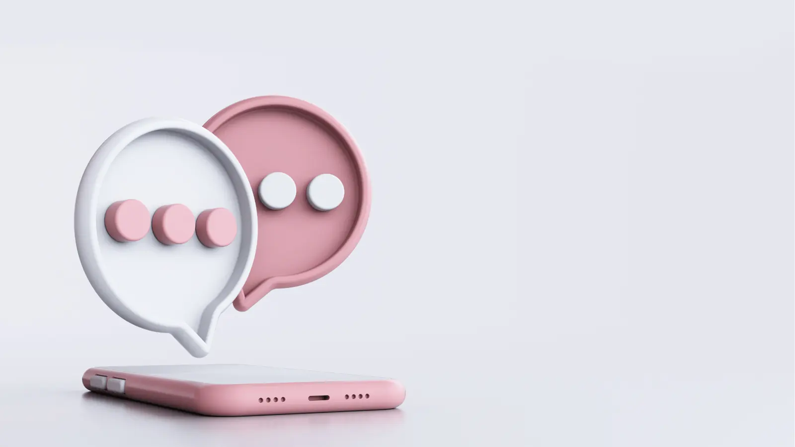 Pink and white 3D chat bubbles floating above a pink smartphone for team collaboration