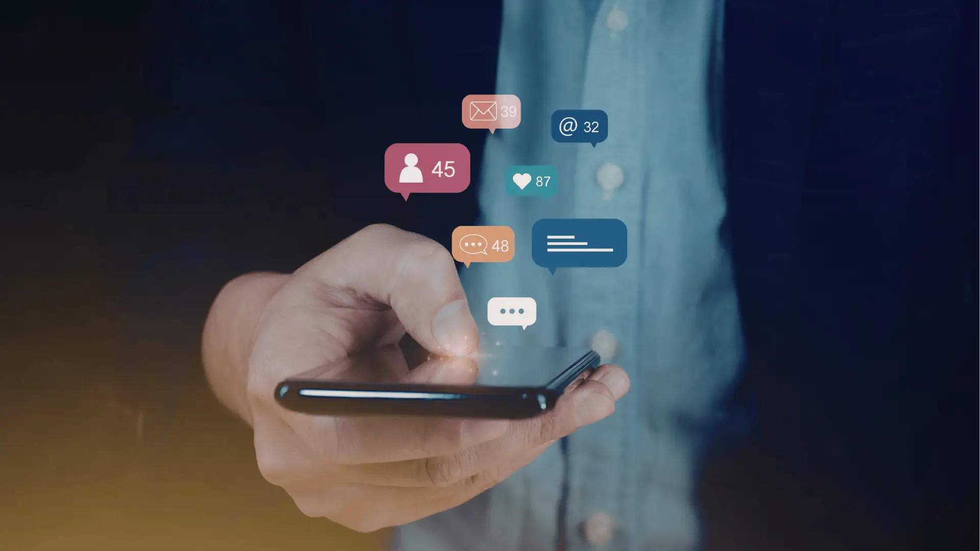 Hand holding smartphone with floating social media notification icons above screen
